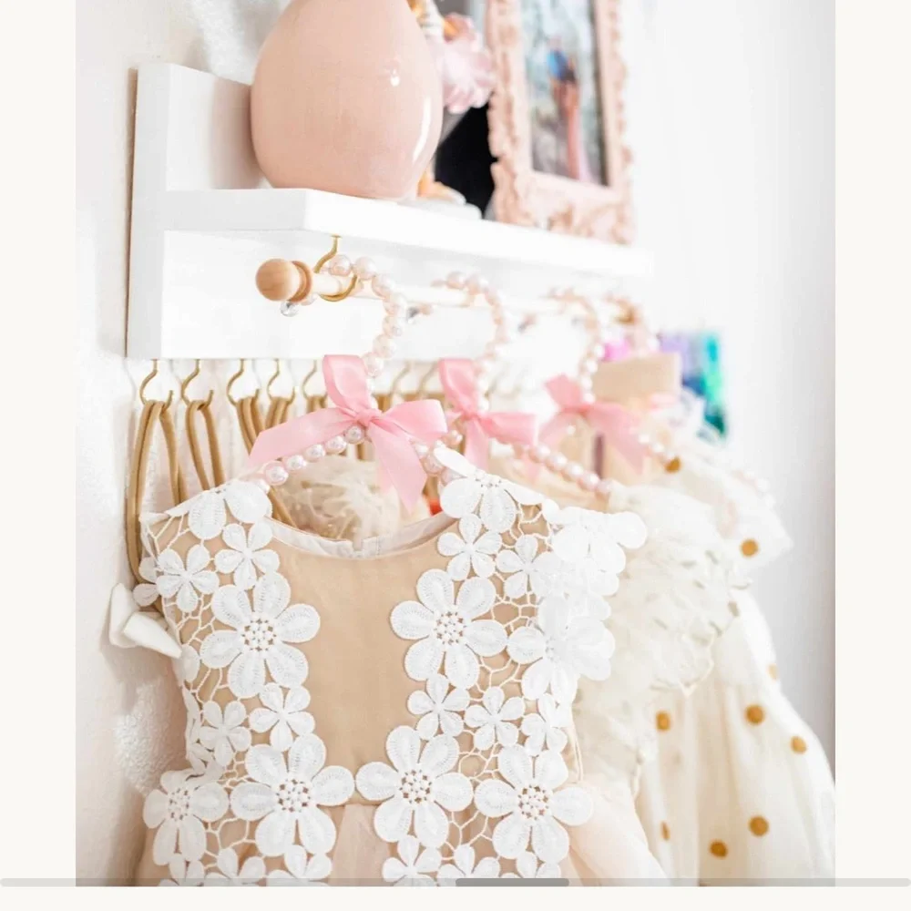 Adorable Nursery bow and clothing rod and shelf for baby girl rooms!